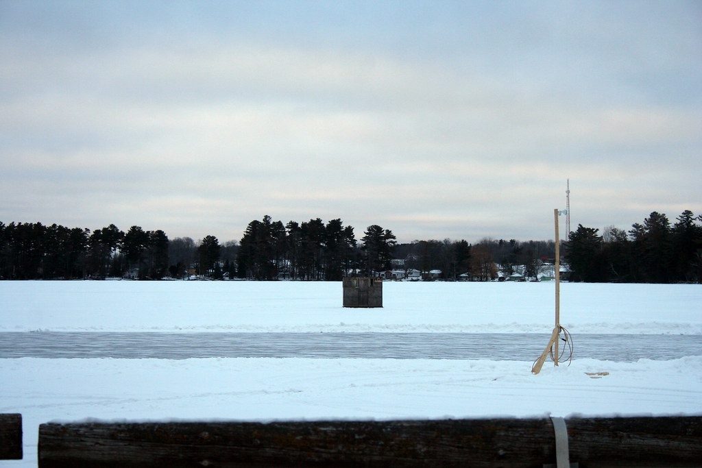 Ice Fishing hut on frozen lake